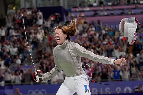 Manon Apithy Brunet celebrates after winning women's individual Sabre quarterfinal